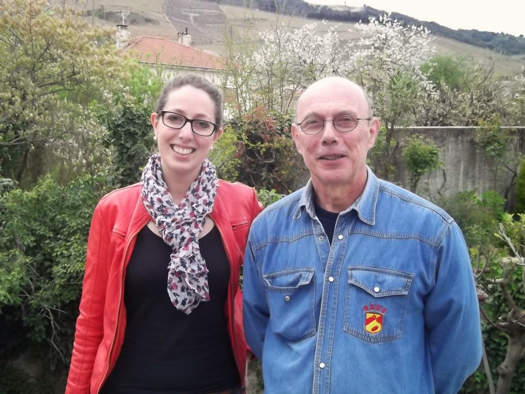 Alain and Emmanuelle Verset with the vineyards of Cornas behind them.